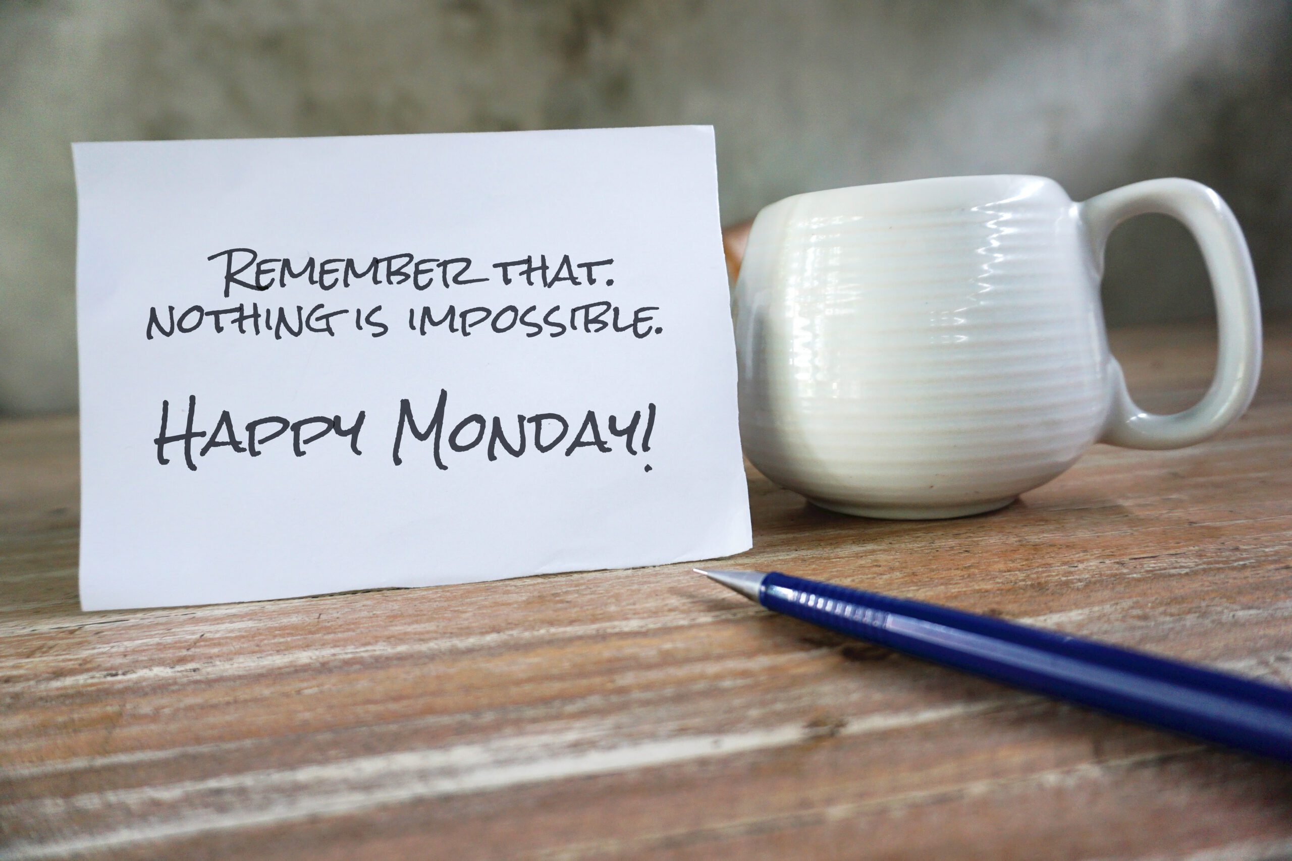 Monday inspirational text message on the table - Remember that nothing's impossible. Happy Monday